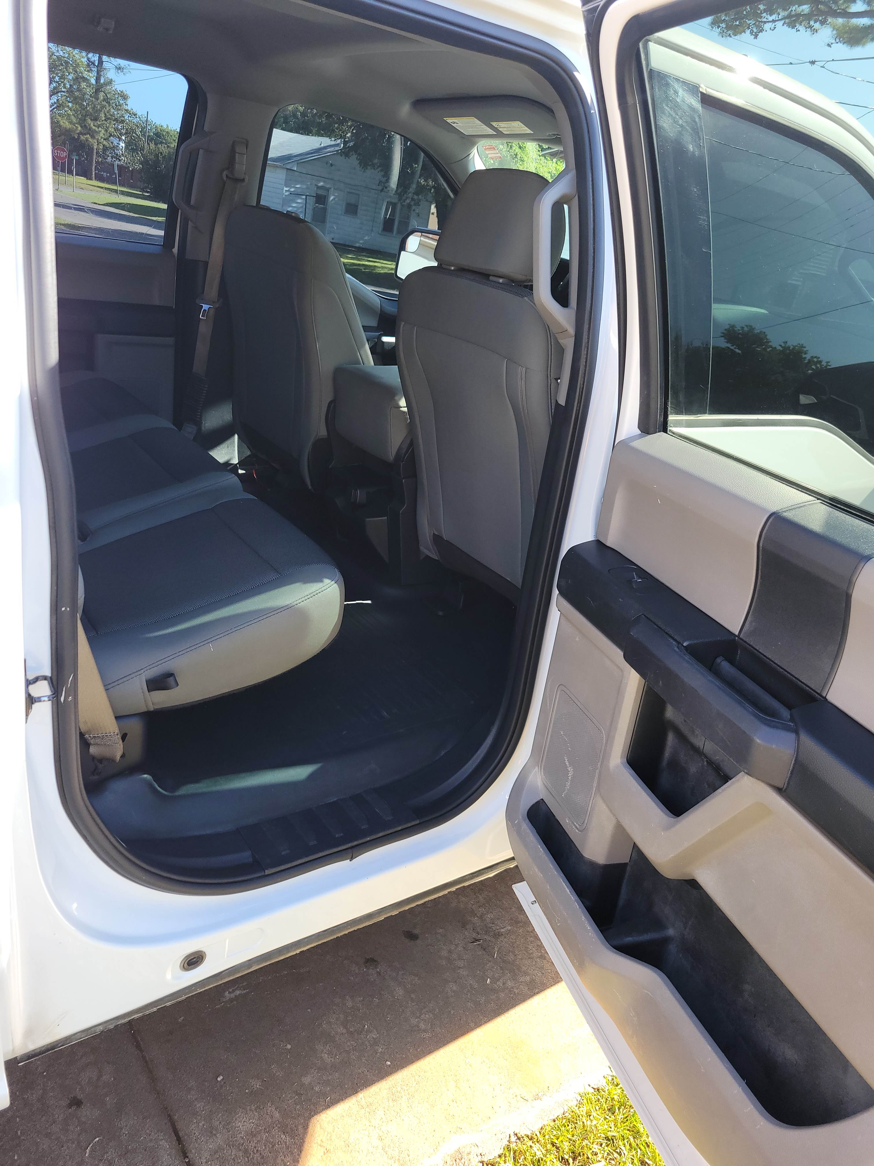 Clean back seat area of a Ford F-150 work truck.
