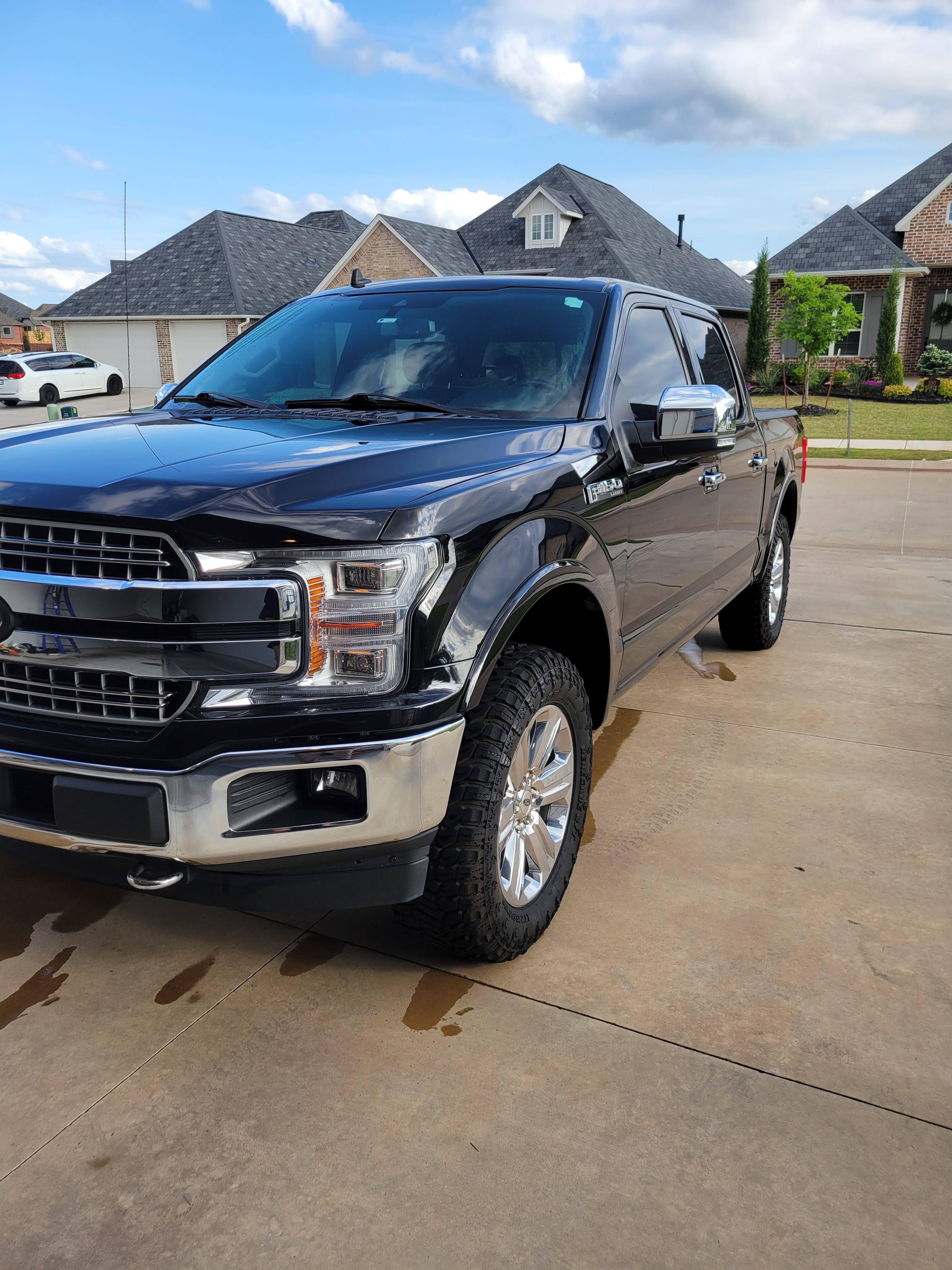 Gleaming black Ford F-150 after an exterior detail.