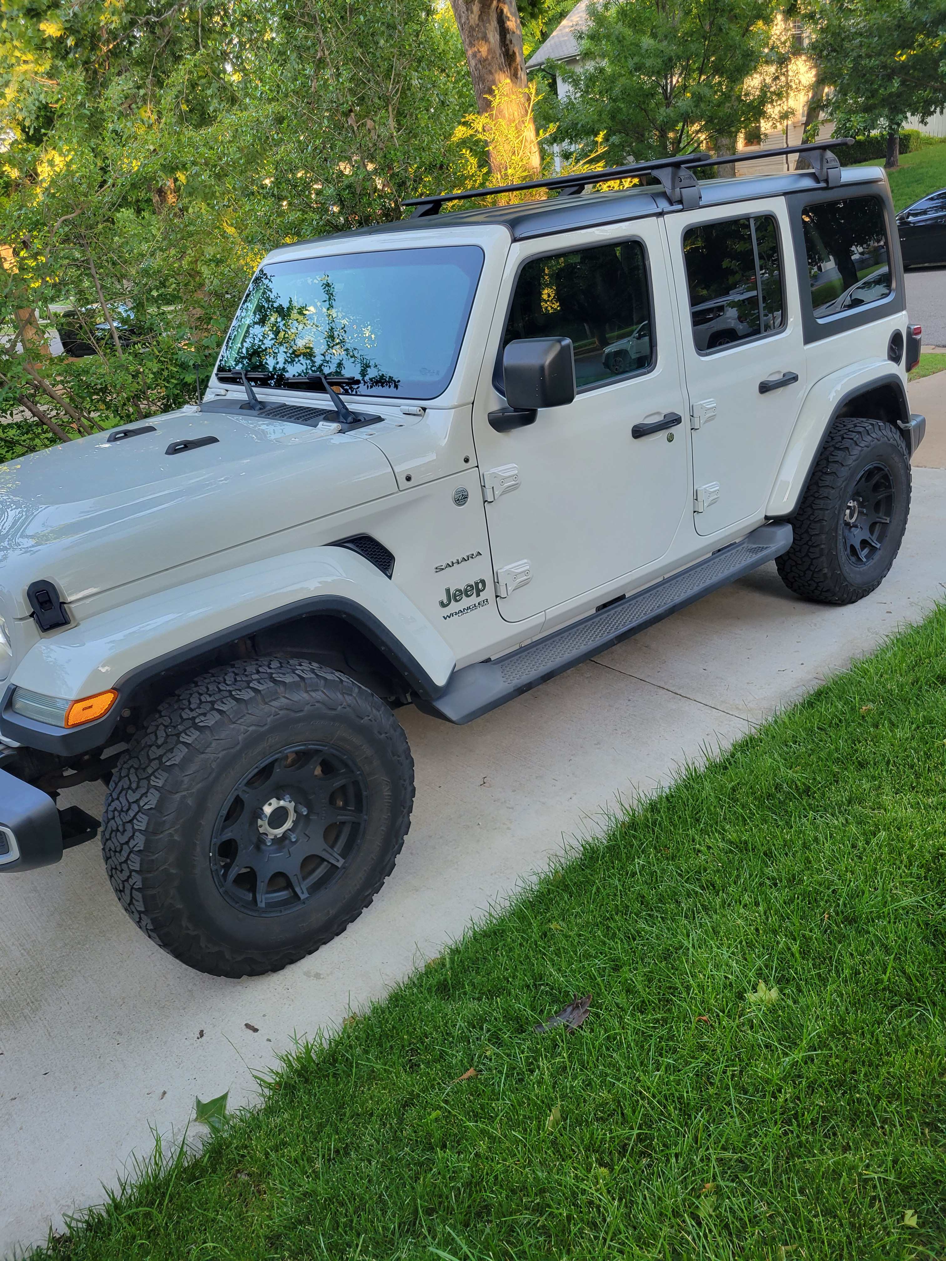 Clean white Jeep Wrangler Sahara ready for adventure.
